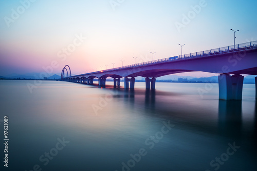 sunrise skyline and landscape of bridge over river