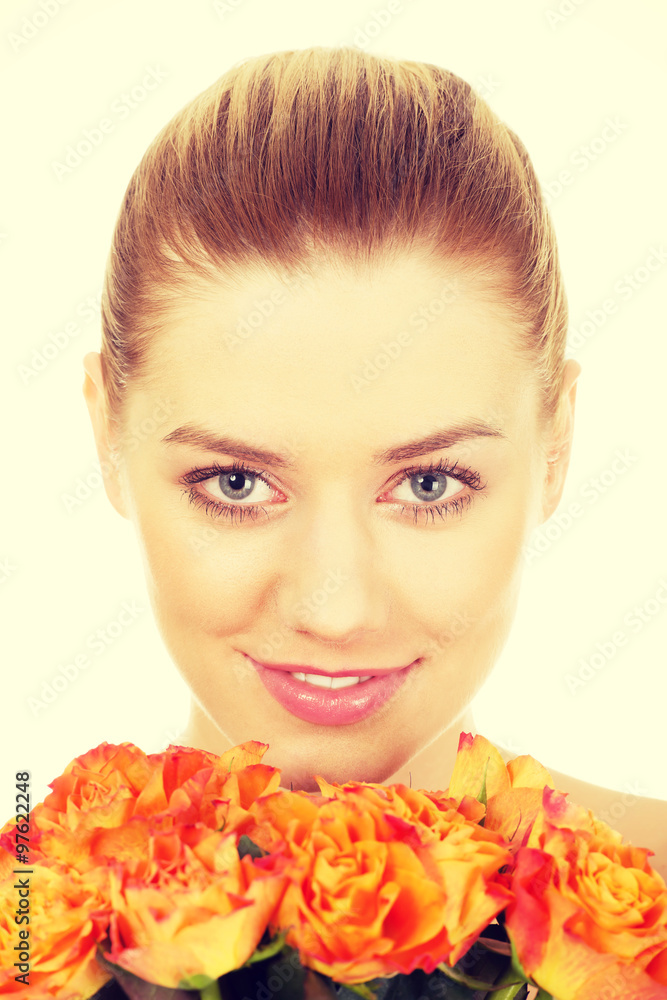 Fototapeta premium Smiling woman with fresh roses.