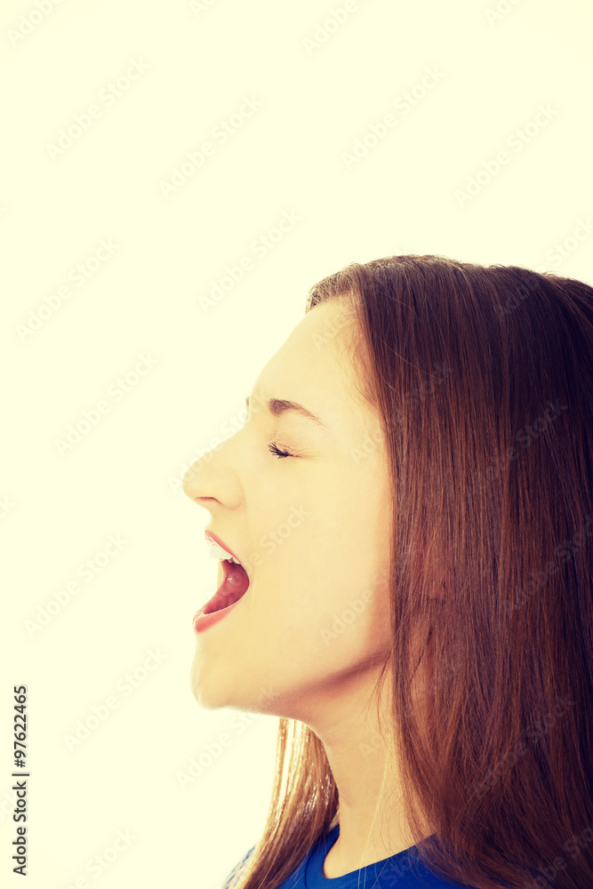 Frustrated young woman screaming. Frustrated young woman screaming.