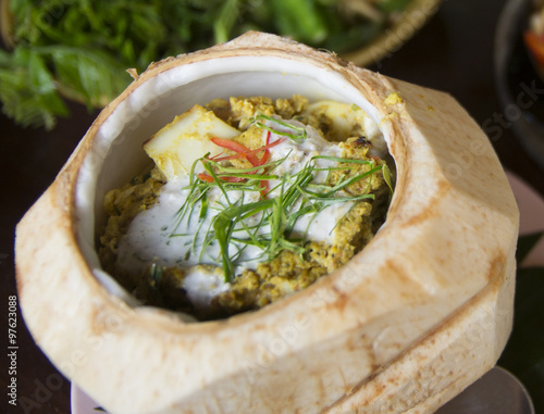 Thai food, Steam seafood with curry paste cakes in Coconut Shell (Haw Mok Thalay) photo