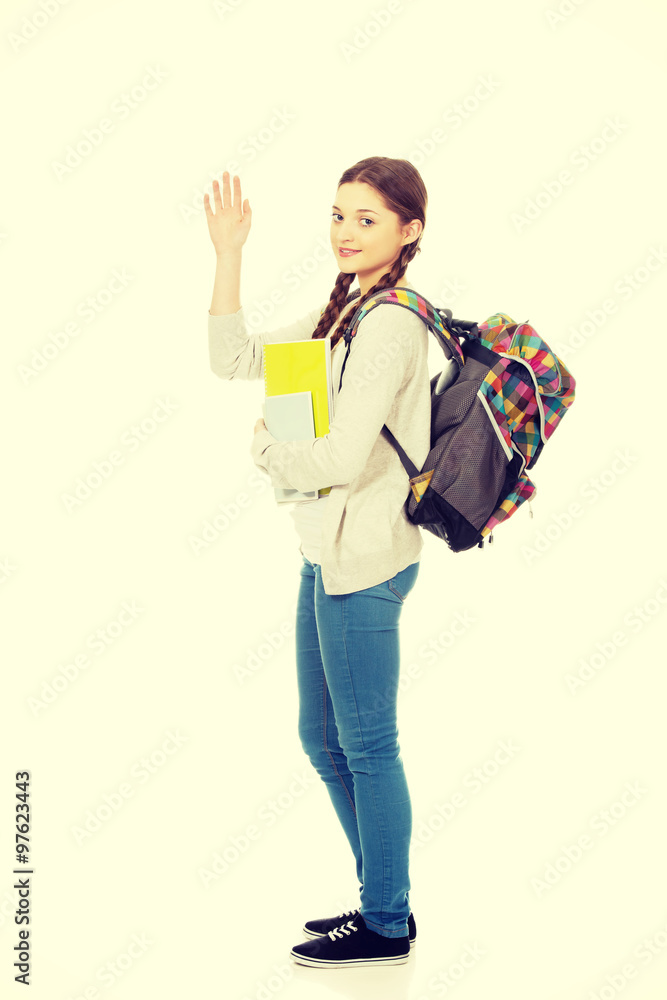 Schoolgirl waving her hand. Schoolgirl waving her hand.