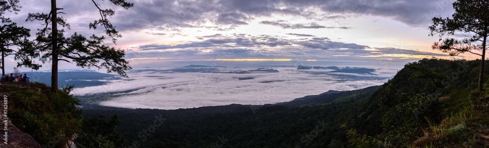 Panoramic view of morning mist with mountain at sunrise at Phu Kradueng national park in Loei, Thailand. Panoramic view of morning mist with mountain at sunrise at Phu Kradueng national park in Loei, Thailand.