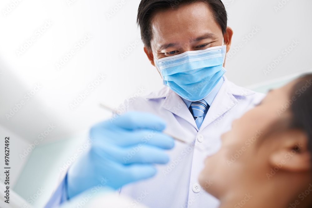 Examining teeth Examining teeth