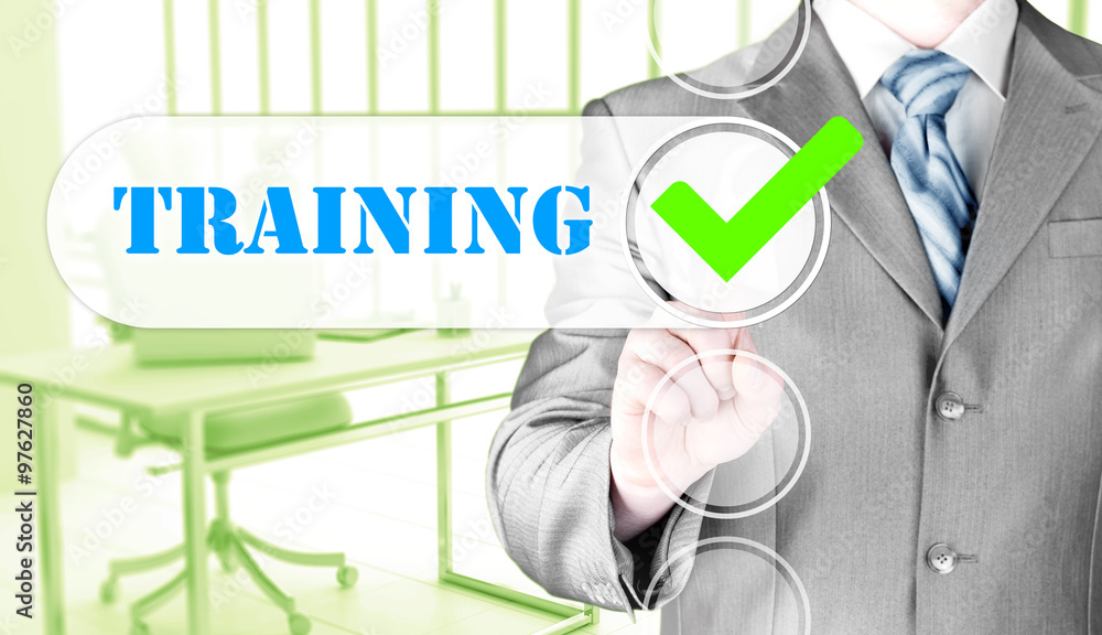 Businessman pressing touch screen interface training checkbox Businessman pressing touch screen interface training checkbox