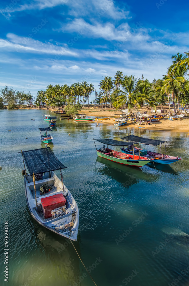 Naklejka premium fisherman boat, blue sky and clouds