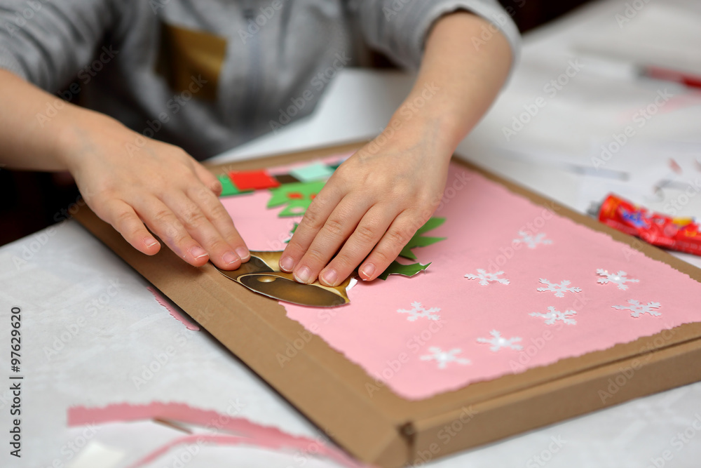 Child making decoration for Christmas Child making decoration for Christmas
