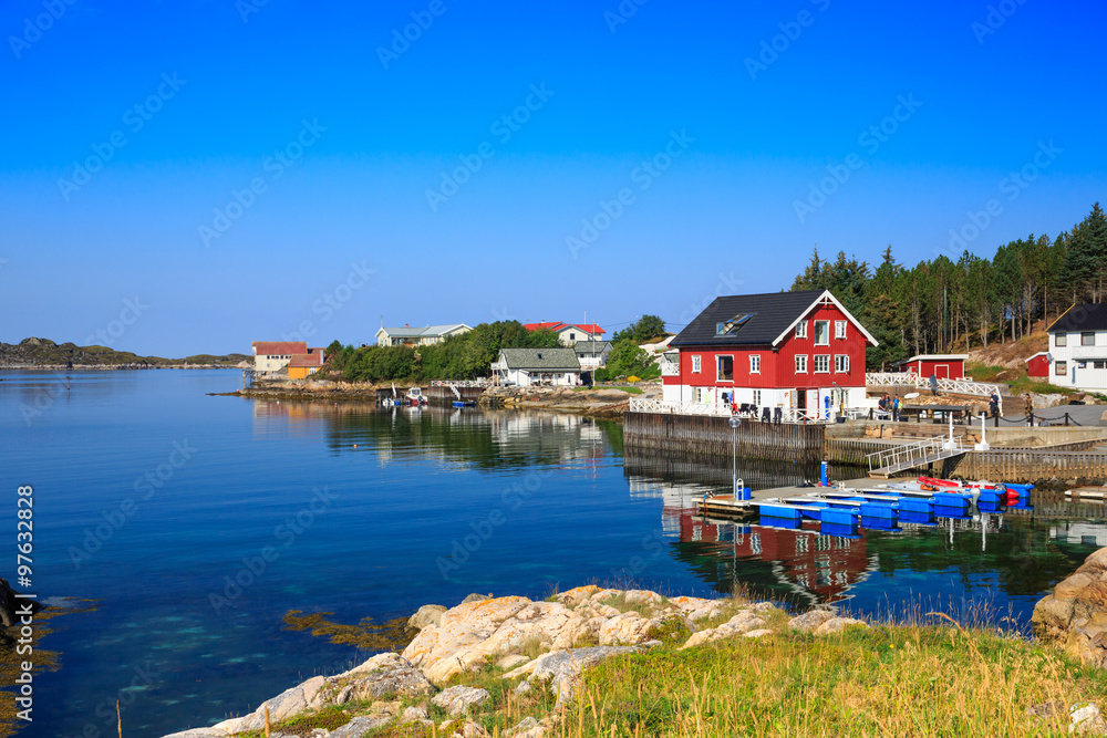 Sea cliffs and houses on the sea in Norway