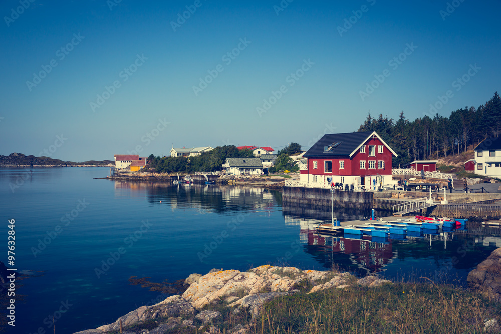 Fototapeta premium Sea cliffs and houses on the sea in Norway