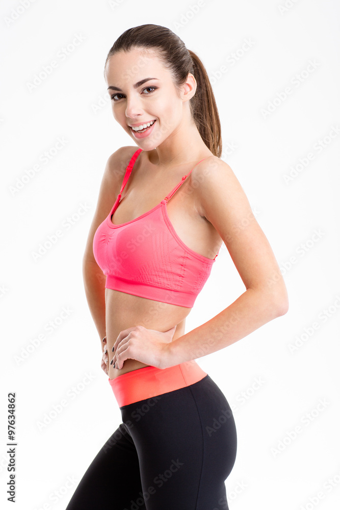 Happy beautiful young fitness woman in sportwear