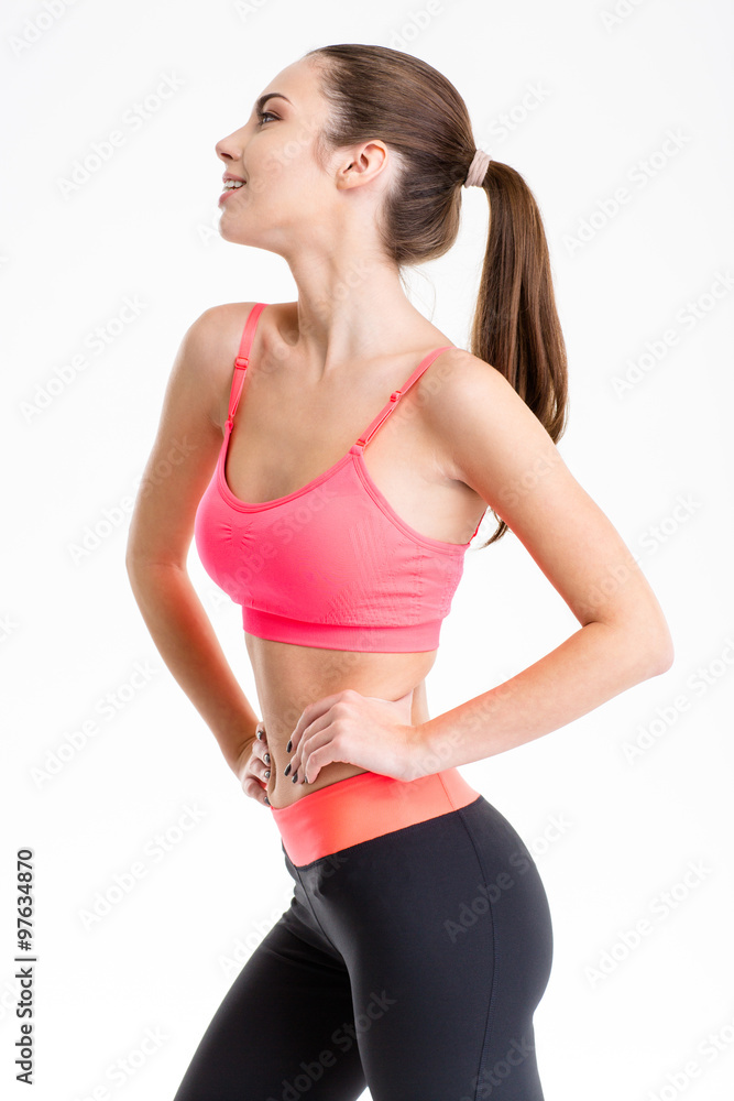 Profile of pretty positive young sportswoman in sports clothes Profile of pretty positive young sportswoman in sports clothes