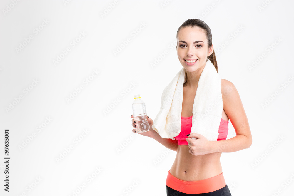 Cheerful fitness woman with white towel on her neck Cheerful fitness woman with white towel on her neck
