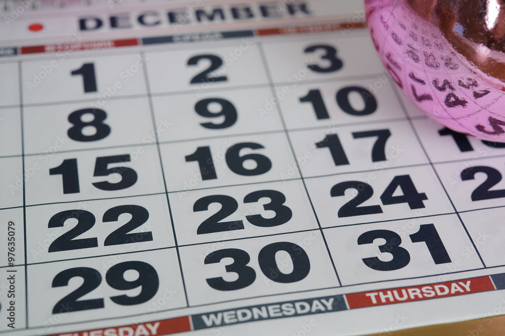 calendar December 2015, the eve of the new 2016 closeup, December 31 Thursday, on the backdrop of pink Christmas balls calendar December 2015, the eve of the new 2016 closeup, December 31 Thursday, on the backdrop of pink Christmas balls