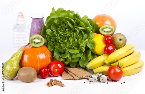 Diet weight loss breakfast concept - organic green salad, pears, grapefruit, tomatoes. pumpkin, quail eggs, nuts, yogurt, water - healthy eating