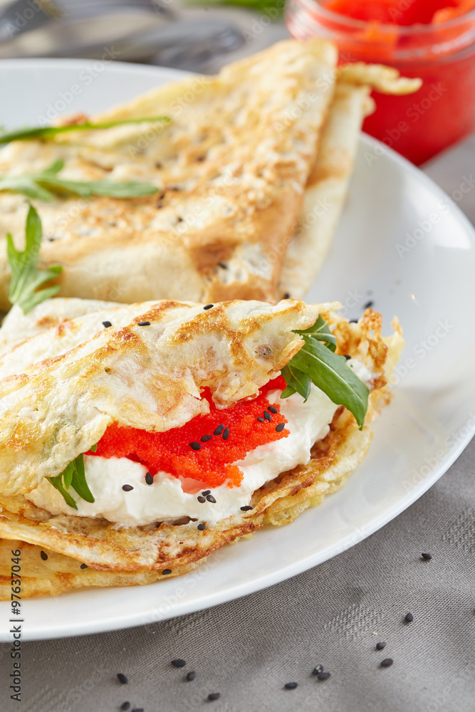 pancakes stuffed with a red caviar pancakes stuffed with a red caviar