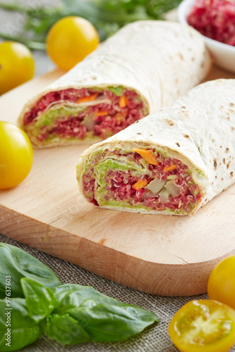 vegetarian rolls stuffed with quinoa, table beet , carrots and o