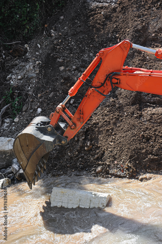 Excavator working in a River Excavator working in a River
