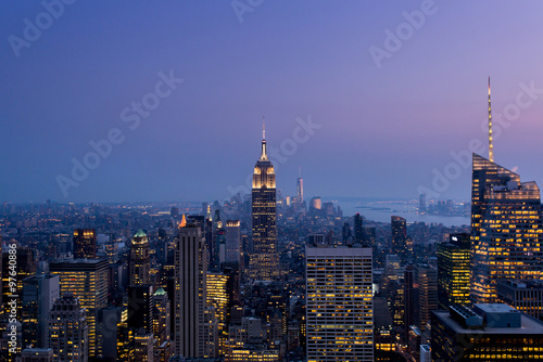 manhattan skyline at dusk seen from a rooftop of manhattan new york city