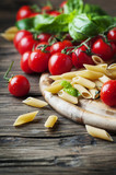 Raw intergal pasta with fresh tomato and basil