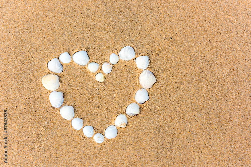 sea shell heart on the sand beach sea shell heart on the sand beach