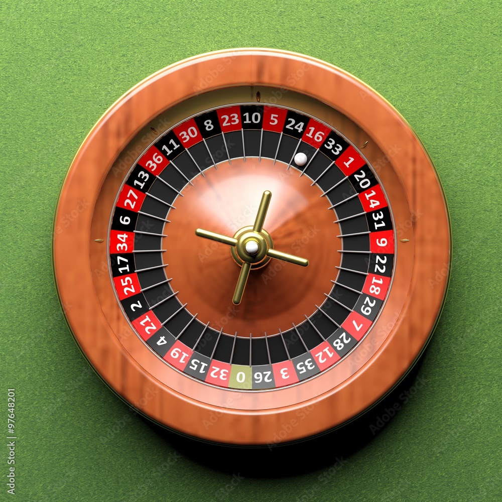 Roulette wheel on green background.From above Roulette wheel on green background.From above