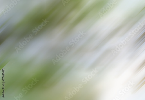 abstract blurred background in light gray and green tones