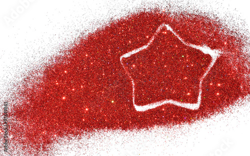 Blurry star of red glitter sparkle on white background