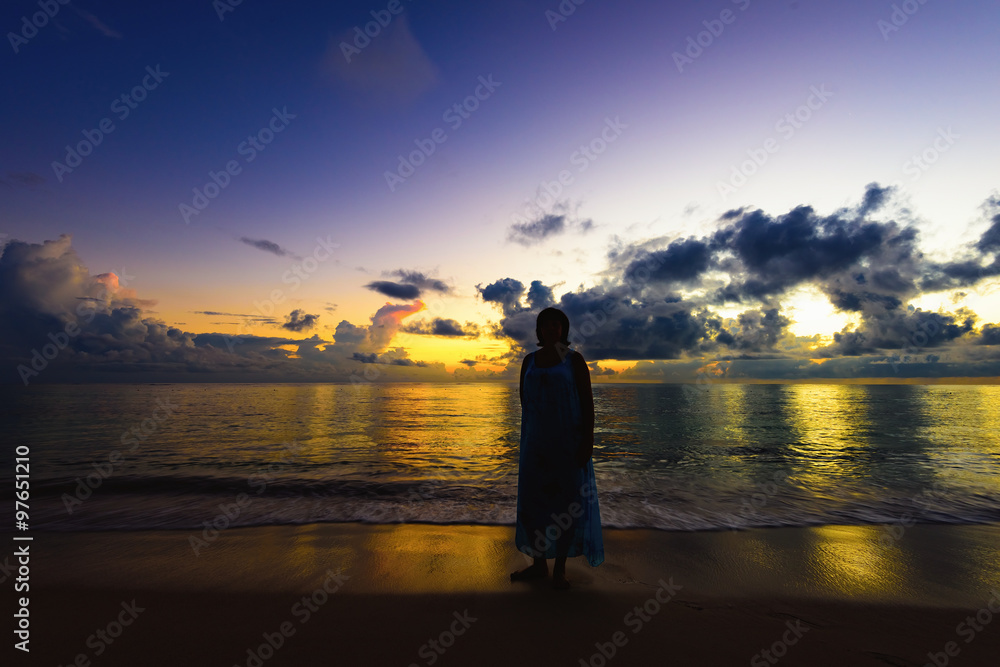 silhouette of woman on the beach