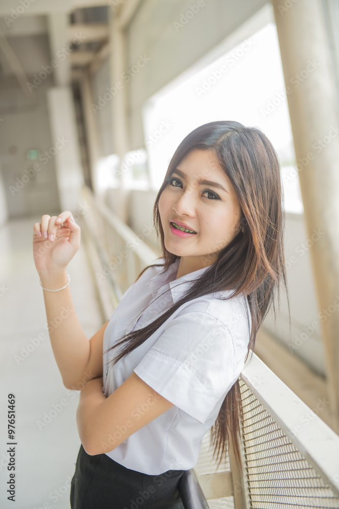 young attractive asian girl in a uniform of university young attractive asian girl in a uniform of university