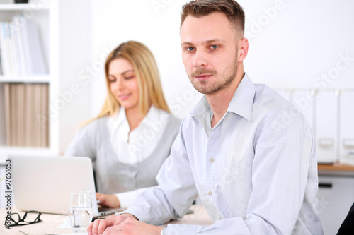 Two successful business partners working at meeting in office