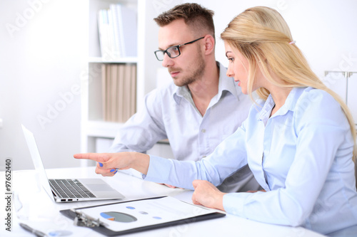 Wallpaper Mural Two successful business partners working at meeting in office Torontodigital.ca