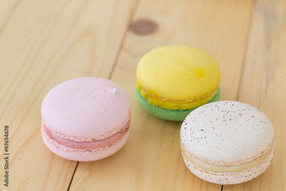 Colorful Macaroons boxset on wooden background. Colorful Macaroons boxset on wooden background.