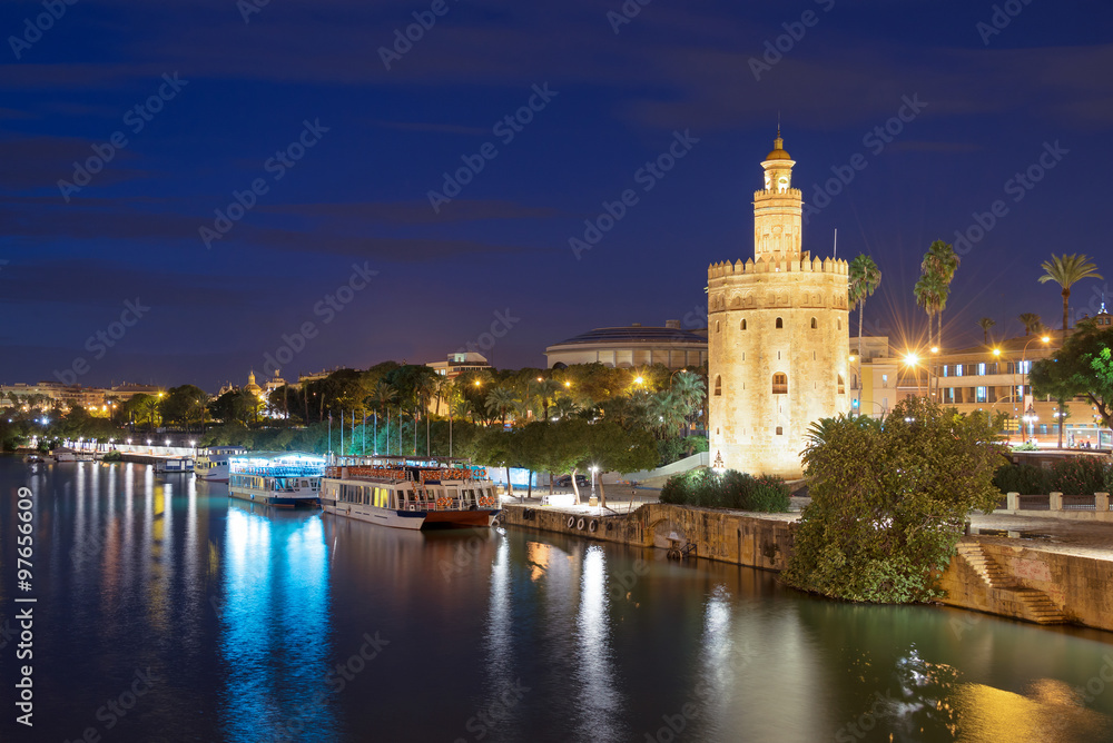 Torre de Oro (Tower of Gold) at night in Seville, Andalusia