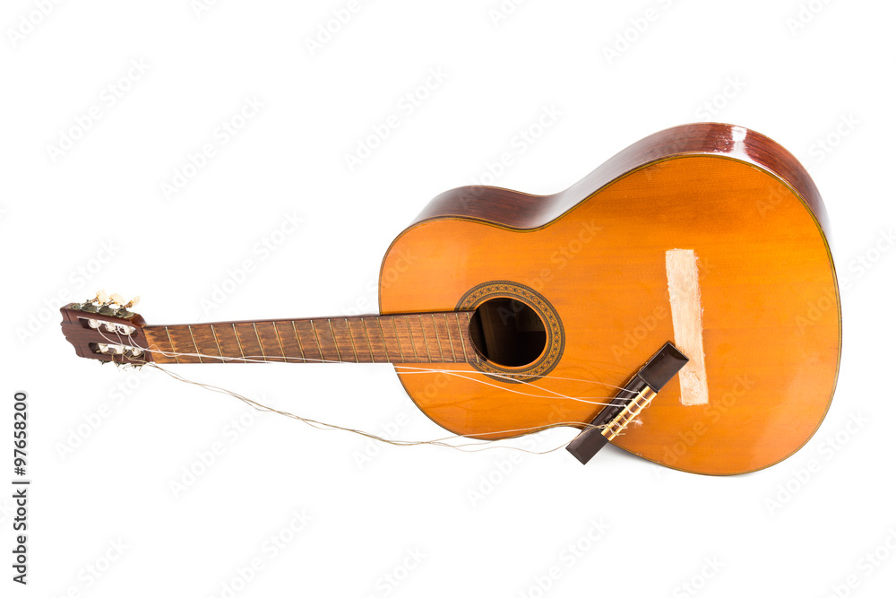 Naklejka premium Broken brown classical guitar with detached bridge from body isolated in white background