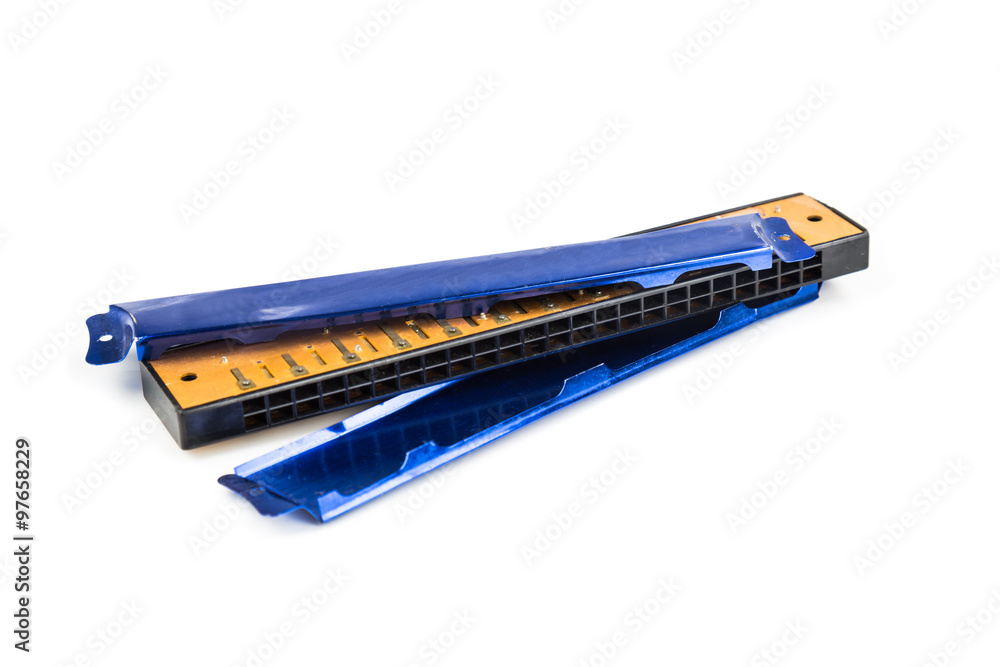 Broken harmonica cover plate isolated in white background Broken harmonica cover plate isolated in white background