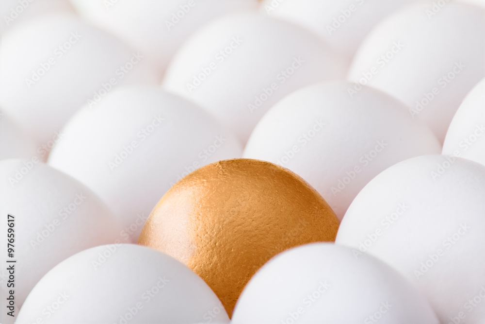 Background with many white and one gold egg Background with many white and one gold egg