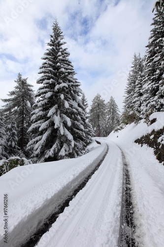 Winter road in Swiss Alps. Switzerland, ski resort