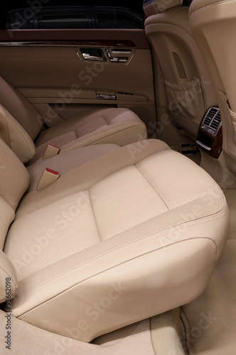 Business car interior detail. Rear leather seats.
