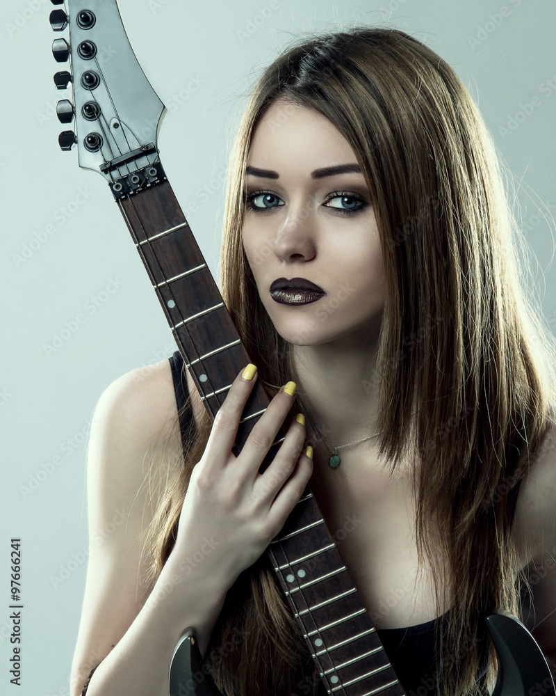 Young Sexy Brunette Model Woman posing with Electric Guitar. Vintage Toned  Photo. Photos | Adobe Stock