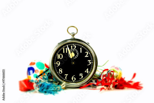 Studio shot of party rattle and noise makers with a clock in the foreground - blur out to edges