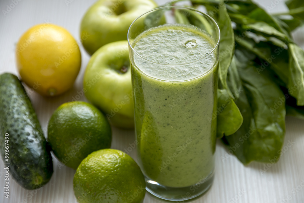 Green Smoothie Close up. Over White Wooden Background. Green Smoothie Close up. Over White Wooden Background.