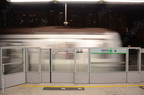 Fototapeta Naklejka Na Ścianę i Meble -  Approaching Train on Hong Kong MTR Platform