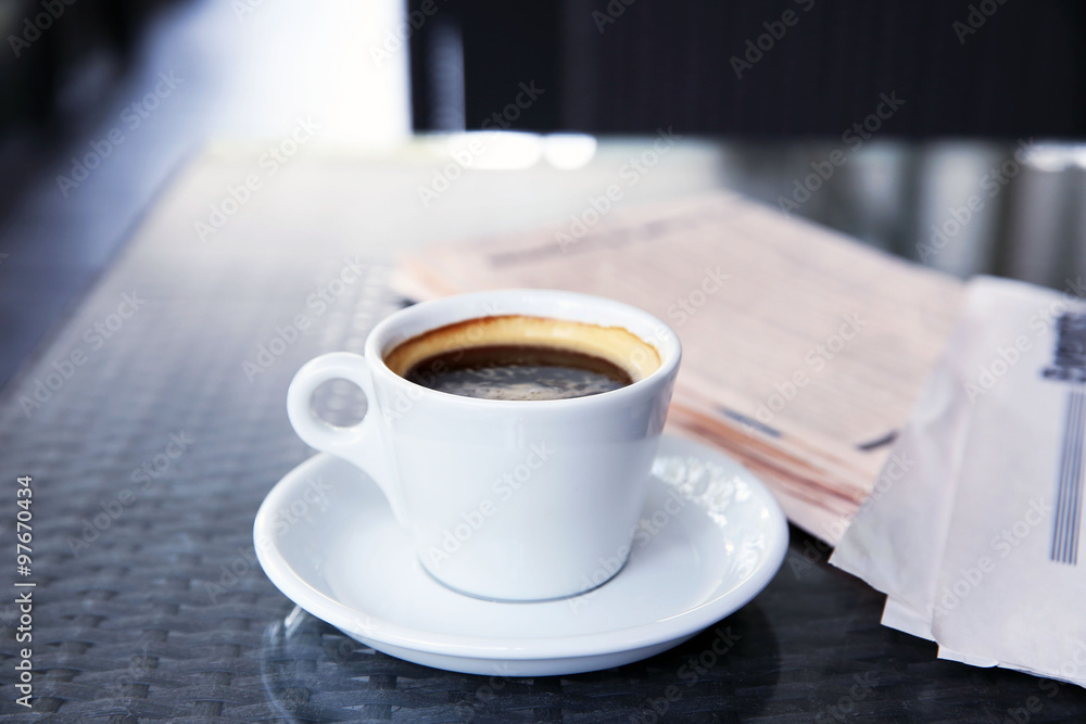 Cup of tasty coffee and newspapers in cafe Cup of tasty coffee and newspapers in cafe
