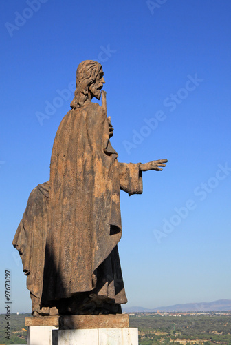 MADRID, SPAIN - AUGUST 23, 2012: Statues of the Cathedral of Our Lady of Almudena overlooking the city from the base of the dome in Madrid, Spain