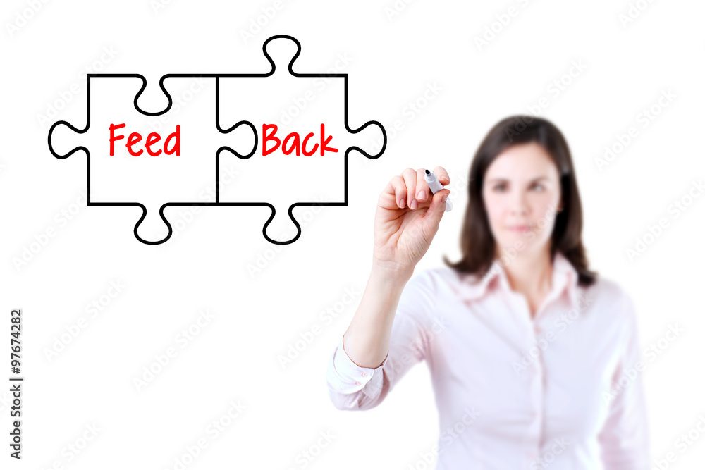 Businesswoman drawing a Feedback puzzle concept on the virtual screen. Isolated on white. Businesswoman drawing a Feedback puzzle concept on the virtual screen. Isolated on white.