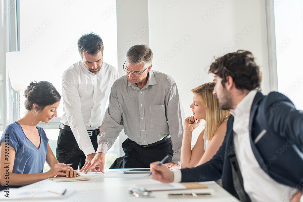 Office business meeting. The team is sitting at a table 