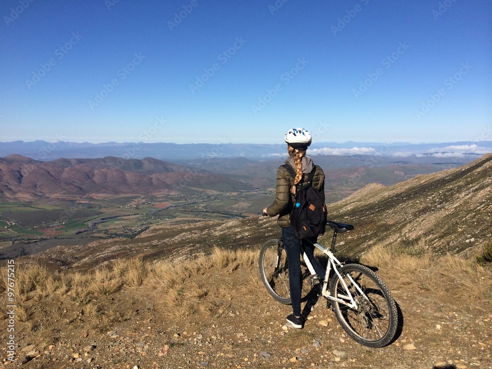 girl cycling on a bike in the mountains girl cycling on a bike in the mountains