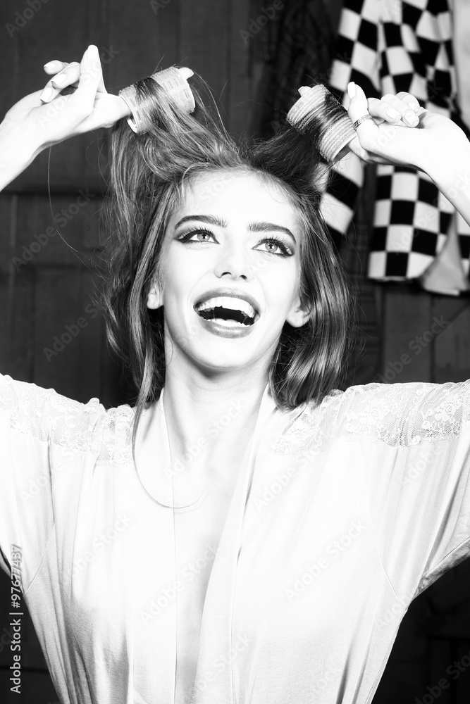 Fototapeta premium Attractive girl with yair-rollers