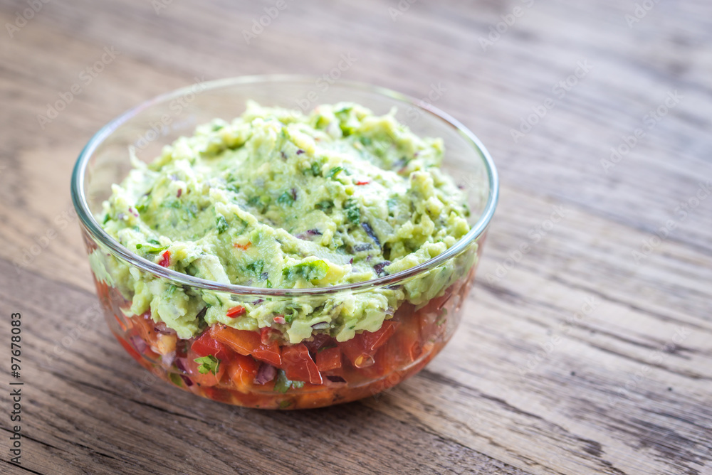 Bowl of guacamole with salsa Bowl of guacamole with salsa