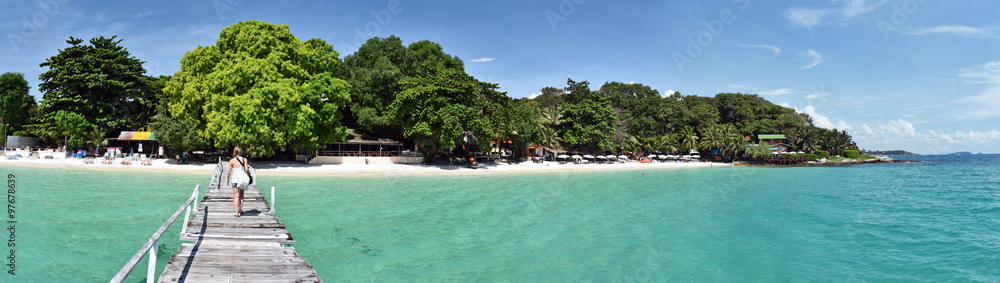 Panorama of the tropical beach resort from wooden jetty