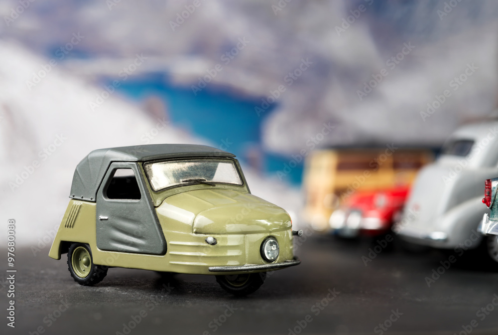 Vintage three-wheeled toy model cars